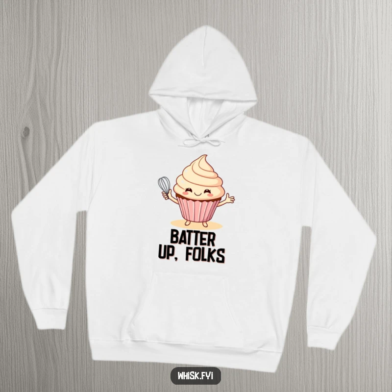 Funny hoodie featuring a smiling cupcake offering a whisk, ideal for staying cozy while baking.